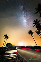 The milky way above the Toyota Estima with light trail taken with Nikon D800E and Samyang 14mm f/2.8